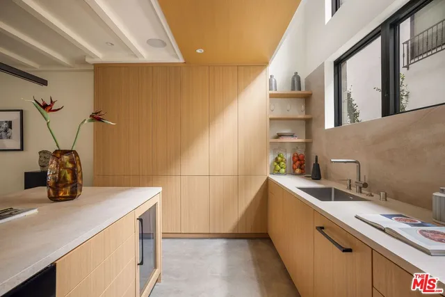 a kitchen with sink cabinets and appliances