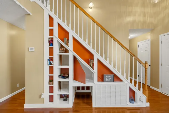 a kitchen with a sink a stove and cabinets
