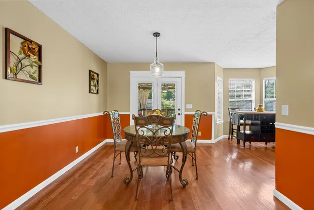 a view of living room with furniture and wooden floor