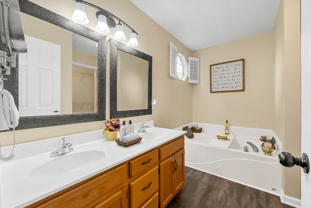 a view of a deck with furniture and a backyard