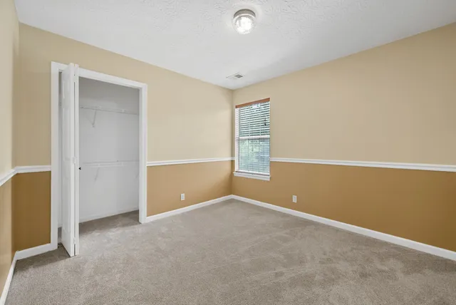 a view of a balcony with next to a yard