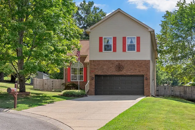 a view of a dining room with furniture a chandelier and wooden floor