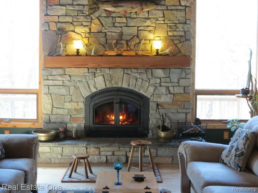 9895 Gibbs Road Clarkston, MI 48348 - Photo 19 of 75 Cast iron insert for warm and cozy fires.