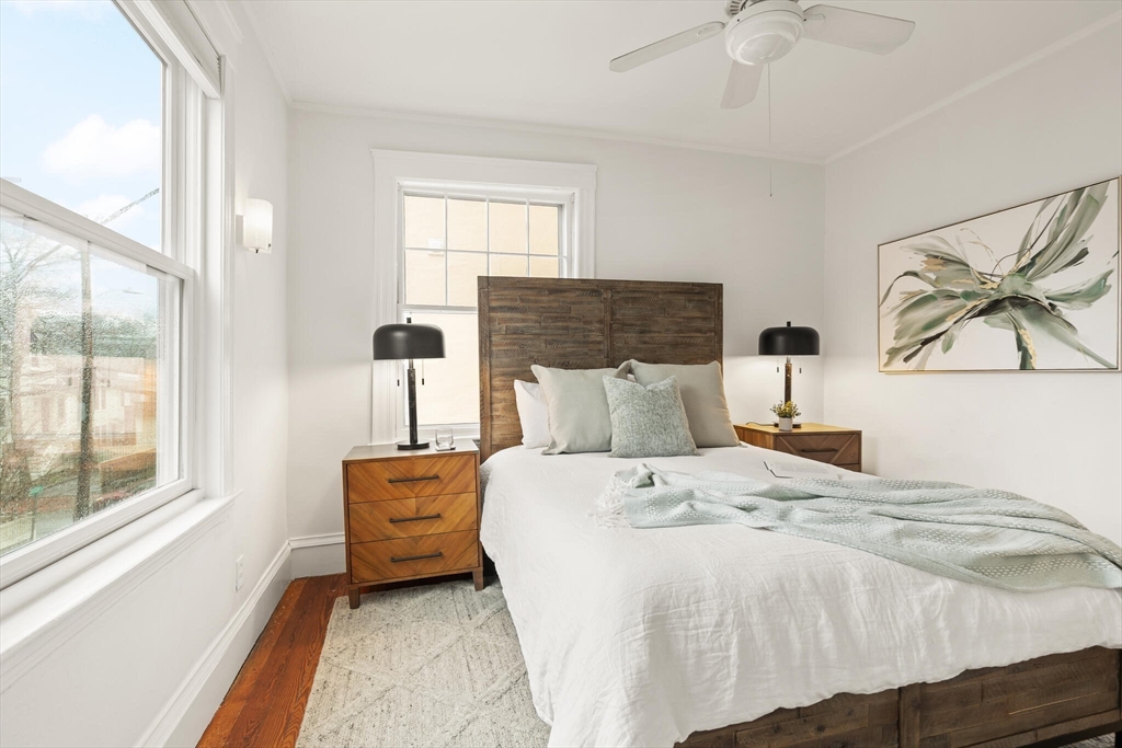 60 Crescent Street, Unit 2 Cambridge, MA 02138 - Photo 13 of 23 a bedroom with a bed and window
