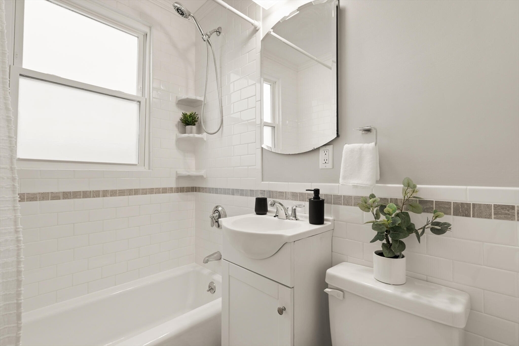 60 Crescent Street, Unit 2 Cambridge, MA 02138 - Photo 14 of 23 a bathroom with a sink and a mirror