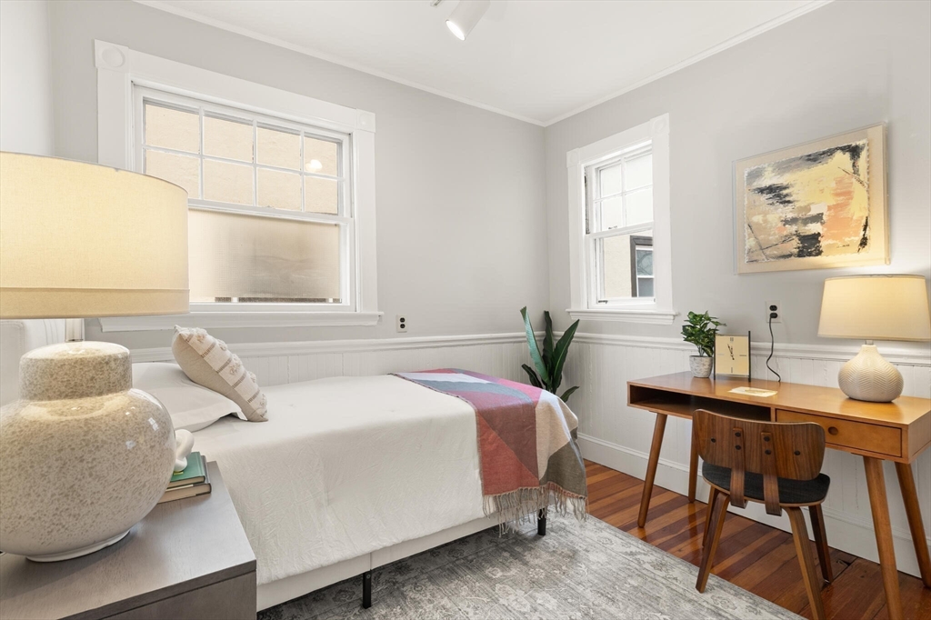 60 Crescent Street, Unit 2 Cambridge, MA 02138 - Photo 15 of 23 a bedroom with a bed and wooden floor
