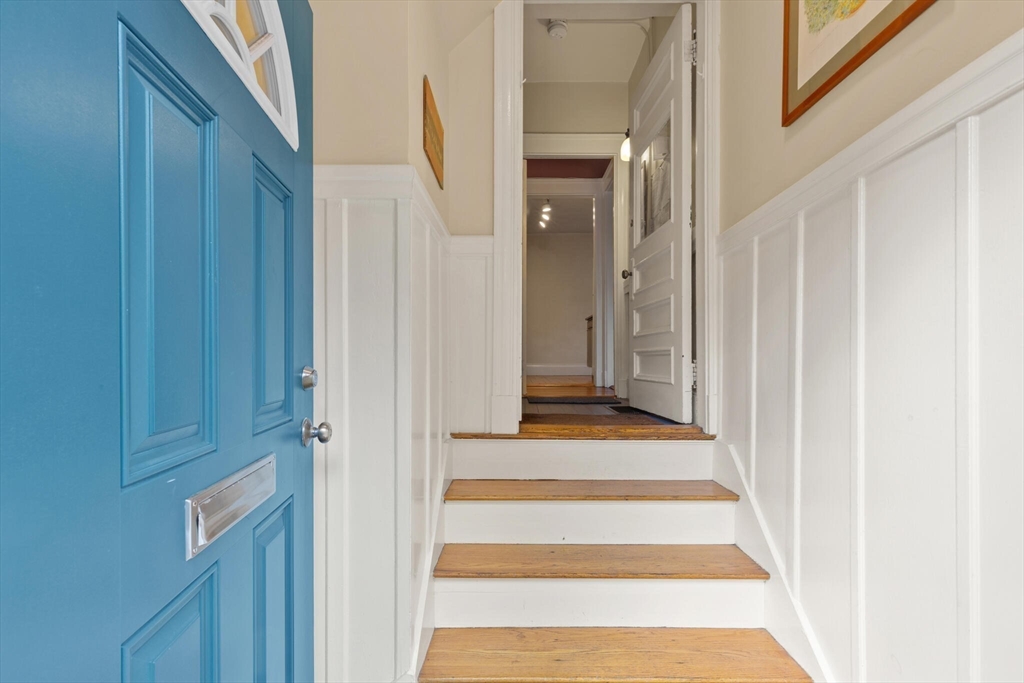 60 Crescent Street, Unit 2 Cambridge, MA 02138 - Photo 18 of 23 a view of a hallway with wooden floor and staircase