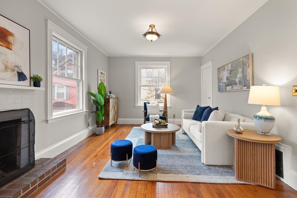 60 Crescent Street, Unit 2 Cambridge, MA 02138 - Photo 2 of 23 a living room with furniture and a fireplace