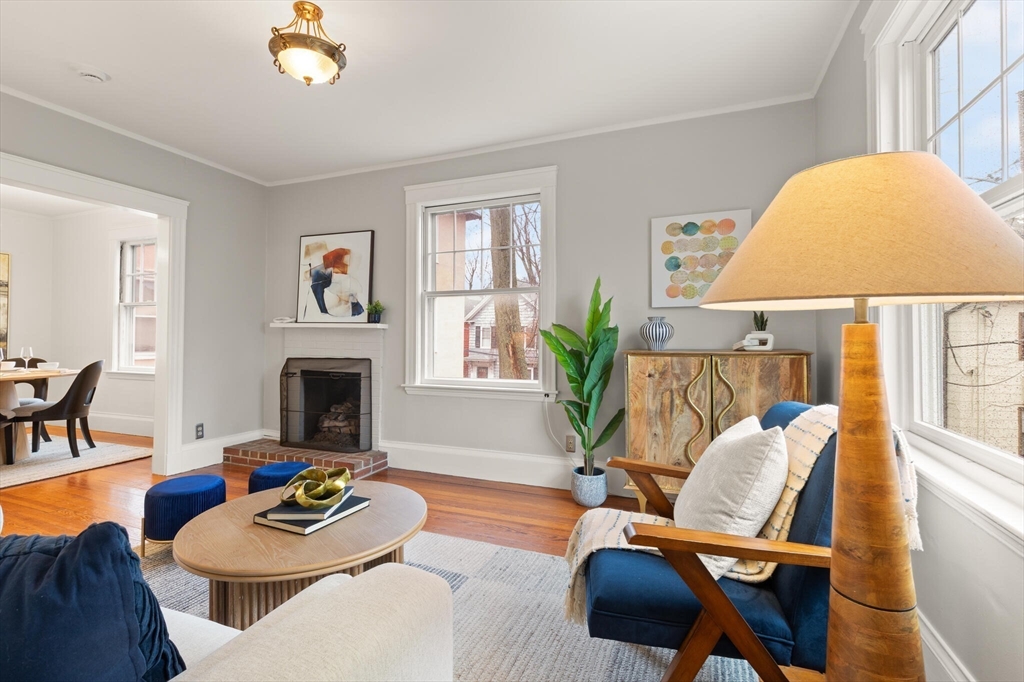 60 Crescent Street, Unit 2 Cambridge, MA 02138 - Photo 3 of 23 a living room with furniture and a fireplace