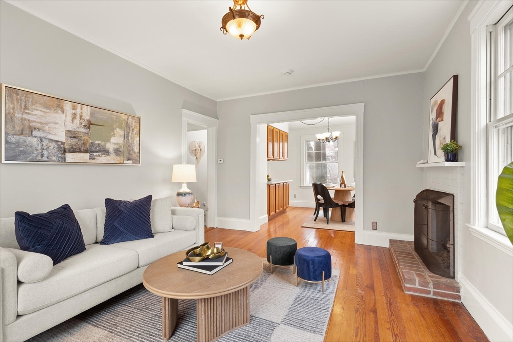 60 Crescent Street, Unit 2 Cambridge, MA 02138 - Photo 4 of 23 a living room with furniture and a fireplace
