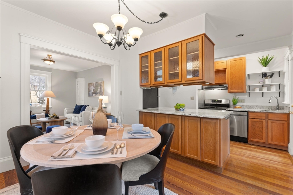 60 Crescent Street, Unit 2 Cambridge, MA 02138 - Photo 7 of 23 a dining room with a table chairs and kitchen view
