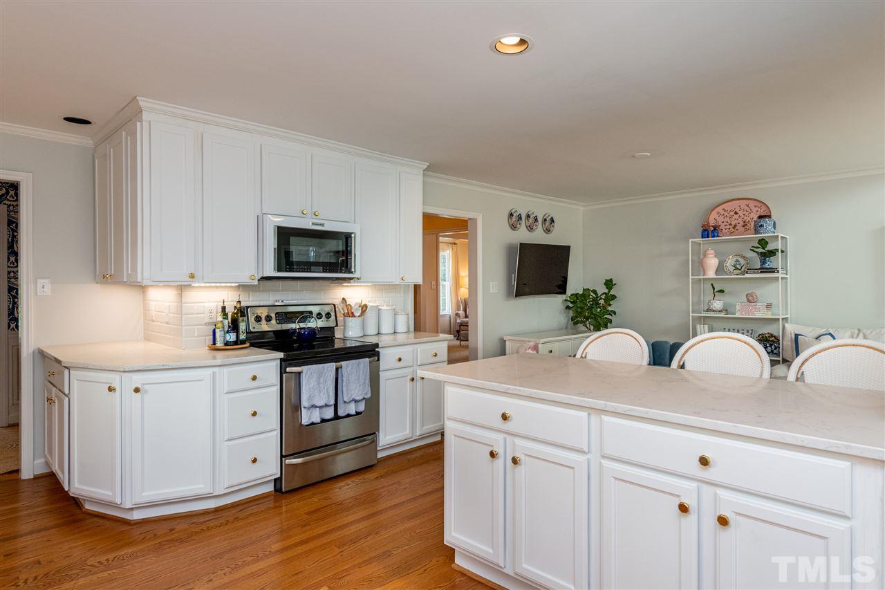 2705 Cooleemee Drive Raleigh, NC 27608 - Photo 13 of 30 This angle lets you see the open kitchen to family room layout.