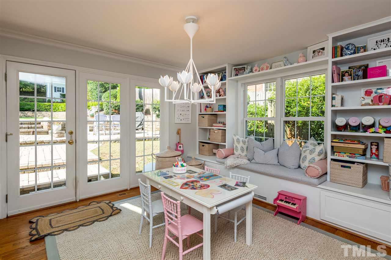 2705 Cooleemee Drive Raleigh, NC 27608 - Photo 15 of 30 The breakfast nook has been enjoyed by the current owners as a space for their daughter. The builtin cabinetry creates a really cool place to sit, read, or enjoy a meal. The shelving is a practical feature as well.