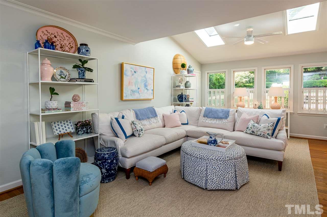 2705 Cooleemee Drive Raleigh, NC 27608 - Photo 16 of 30 The vaulted ceiling and skylights are a great combination for this space!