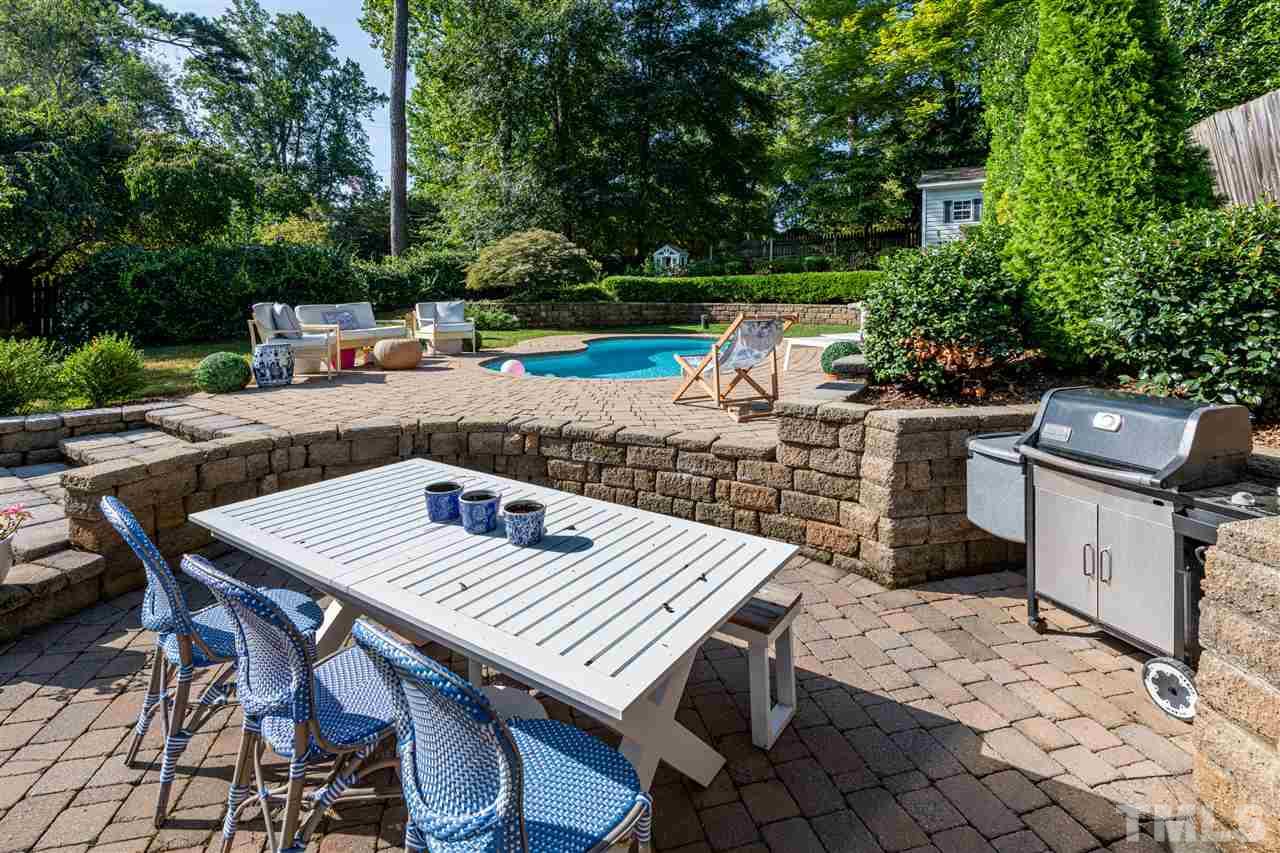 2705 Cooleemee Drive Raleigh, NC 27608 - Photo 24 of 30 The lower outdoor living area offers a niche for your favorite grill and ample room for dining.