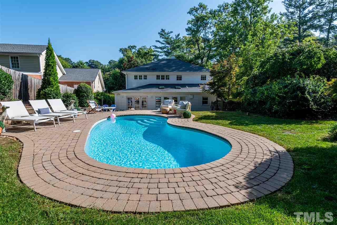 2705 Cooleemee Drive Raleigh, NC 27608 - Photo 26 of 30 There is plenty of space around the pool to spread out and enjoy.