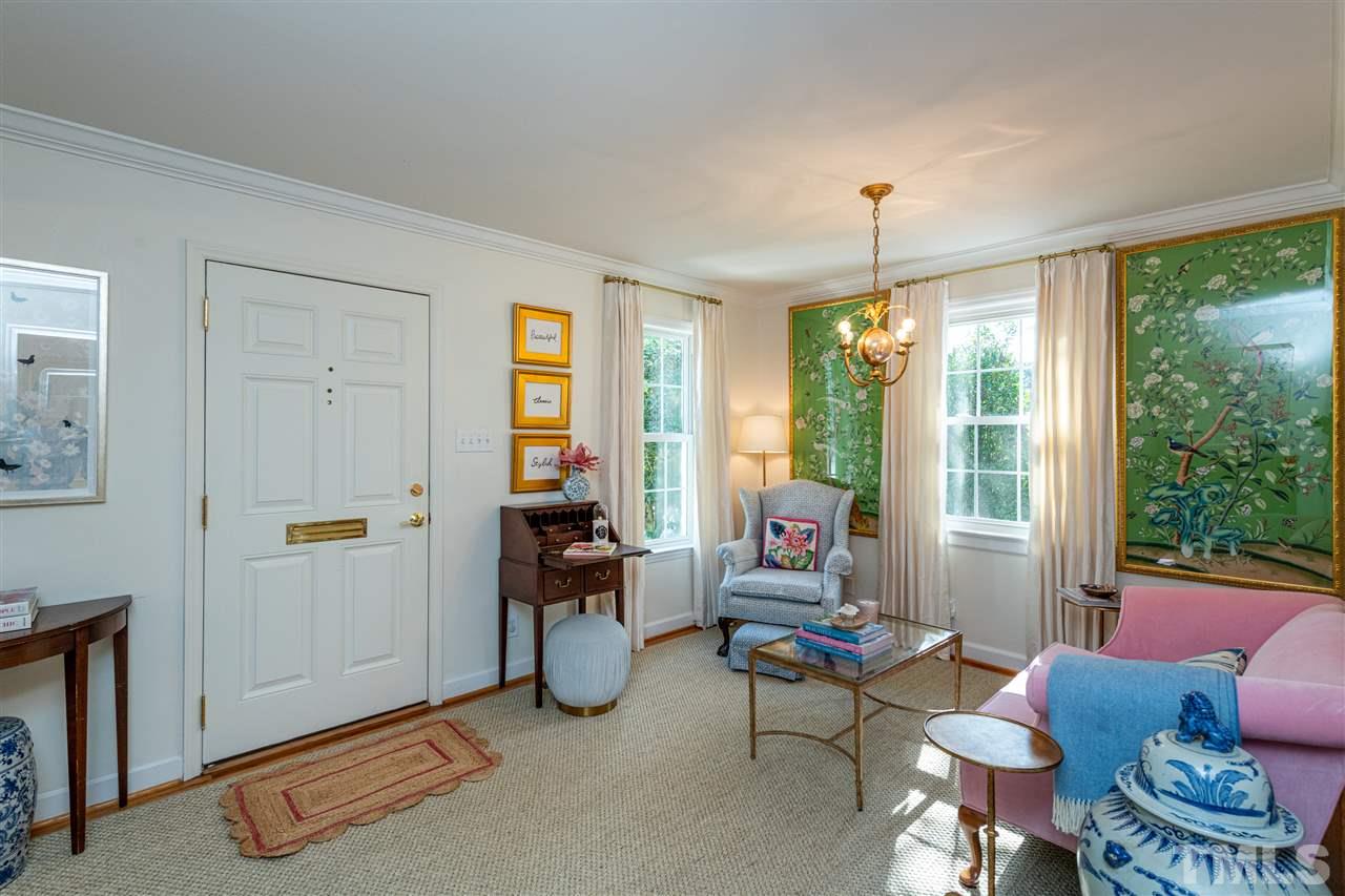2705 Cooleemee Drive Raleigh, NC 27608 - Photo 4 of 30 The sitting room offers a great space for guests to spread out and enjoy conversation when entertaining