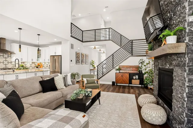 a living room with furniture and a fireplace