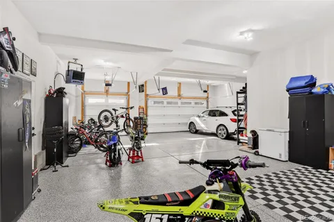 a room with gym equipment and a table