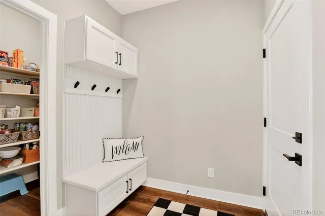 a room with cabinet and white wall