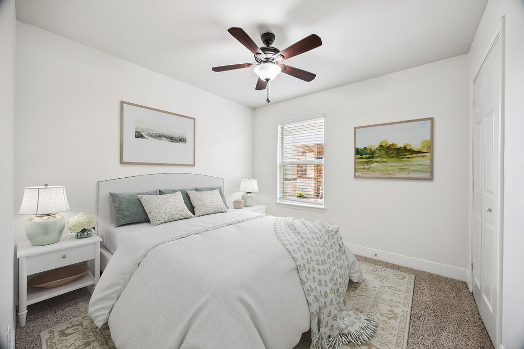 342 Ranch House Lane Richmond, TX 77469 - Photo 12 of 17 a bed room with a bed and a window