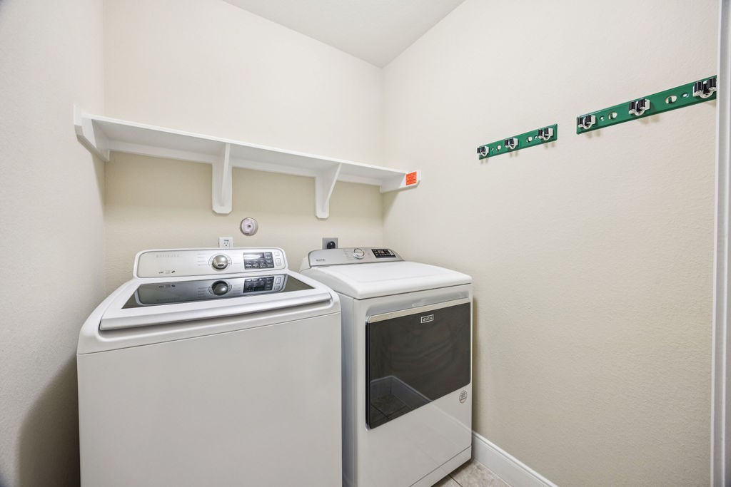 342 Ranch House Lane Richmond, TX 77469 - Photo 14 of 17 a utility room with dryer and washer