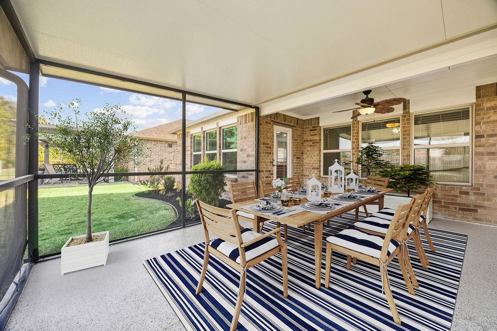 342 Ranch House Lane Richmond, TX 77469 - Photo 15 of 17 a view of a patio with lawn chairs floor to ceiling windows and garden view