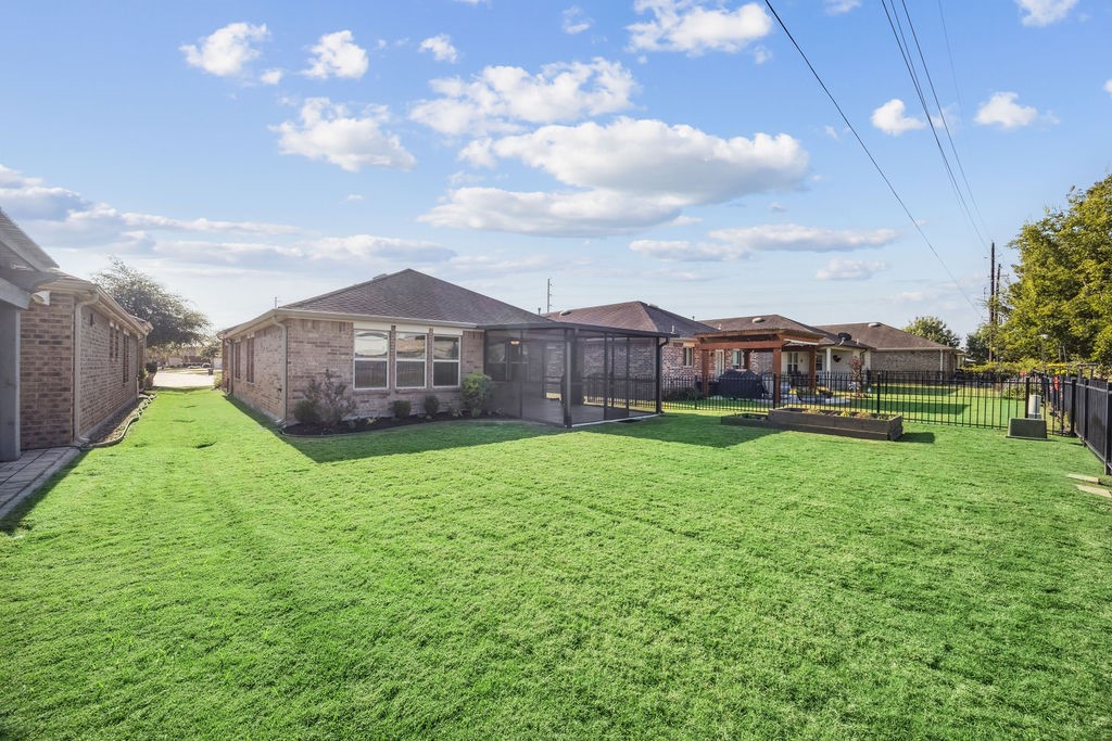 342 Ranch House Lane Richmond, TX 77469 - Photo 16 of 17 a view of a house with a big yard potted plants and large tree