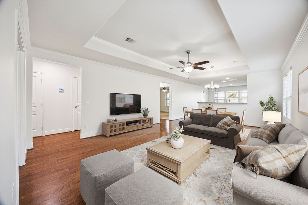 342 Ranch House Lane Richmond, TX 77469 - Photo 3 of 17 a living room with furniture and a flat screen tv