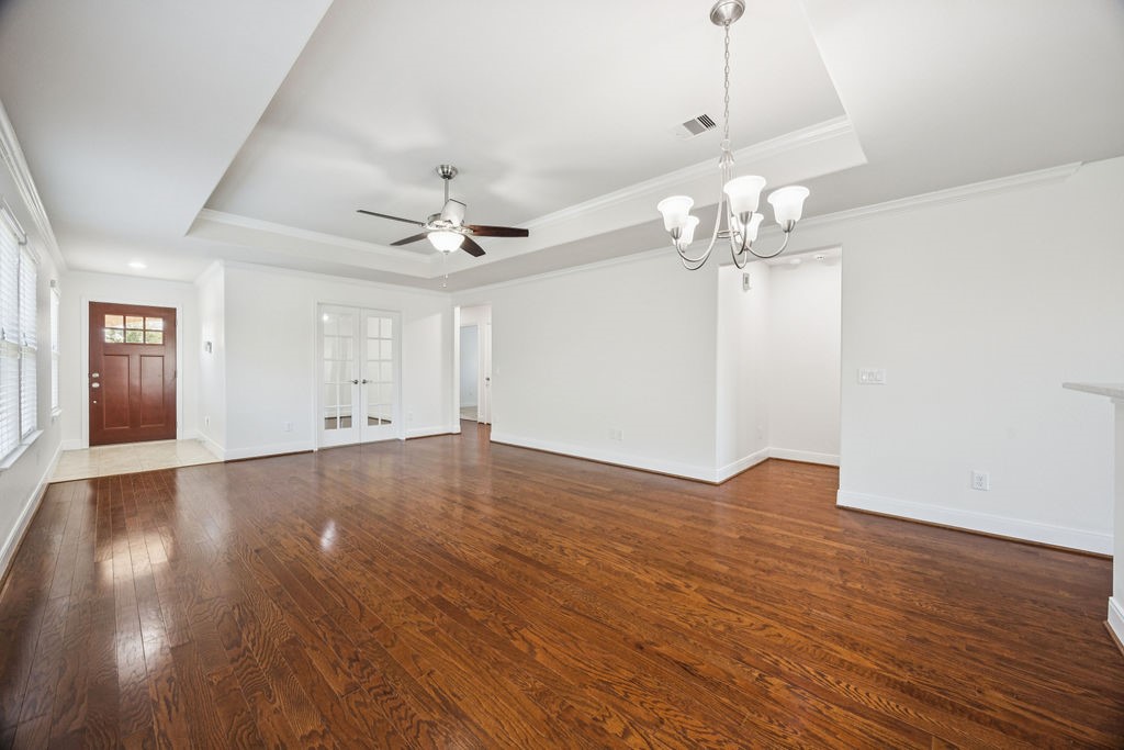342 Ranch House Lane Richmond, TX 77469 - Photo 4 of 17 a view of an empty room with wooden floor