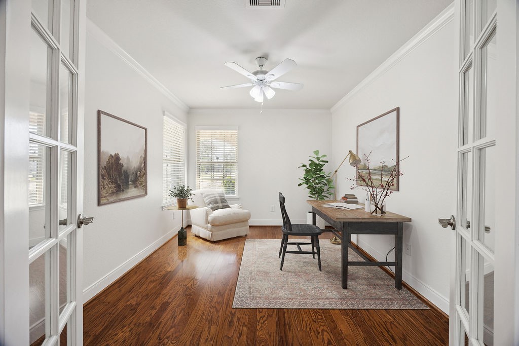 342 Ranch House Lane Richmond, TX 77469 - Photo 7 of 17 a workspace with furniture window and wooden floor