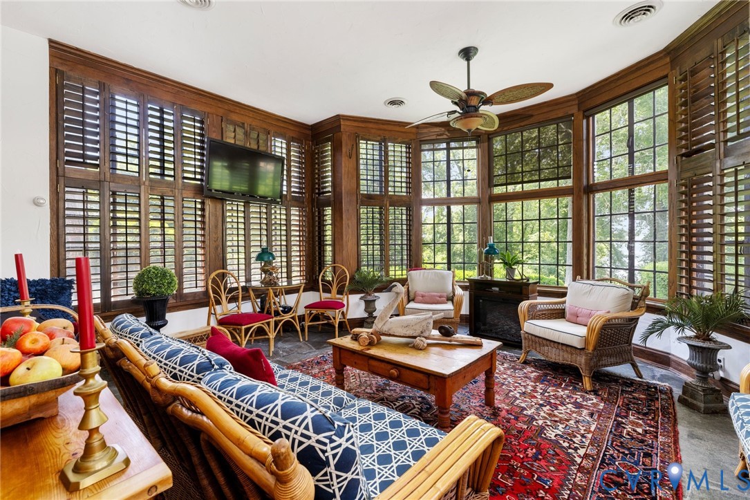 701 Appomattox Street Hopewell, VA 23860 - Photo 13 of 32 a living room with furniture and a floor to ceiling window
