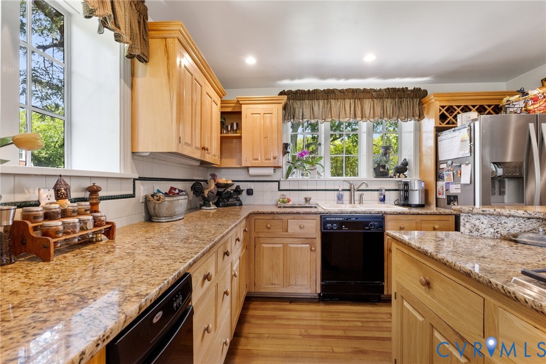 701 Appomattox Street Hopewell, VA 23860 - Photo 15 of 32 a kitchen with a sink stove top oven and refrigerator