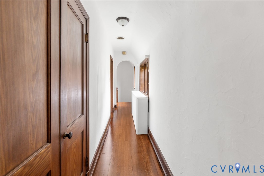 701 Appomattox Street Hopewell, VA 23860 - Photo 21 of 32 a view of a hallway with wooden floor and staircase