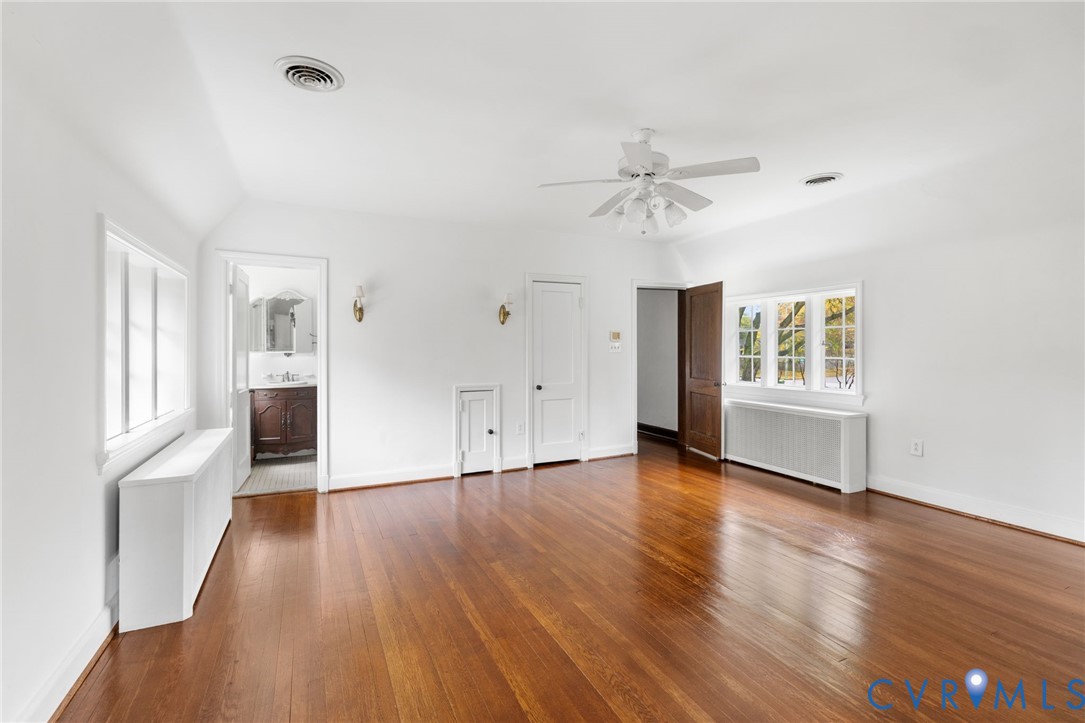 701 Appomattox Street Hopewell, VA 23860 - Photo 22 of 32 an empty room with wooden floor and windows