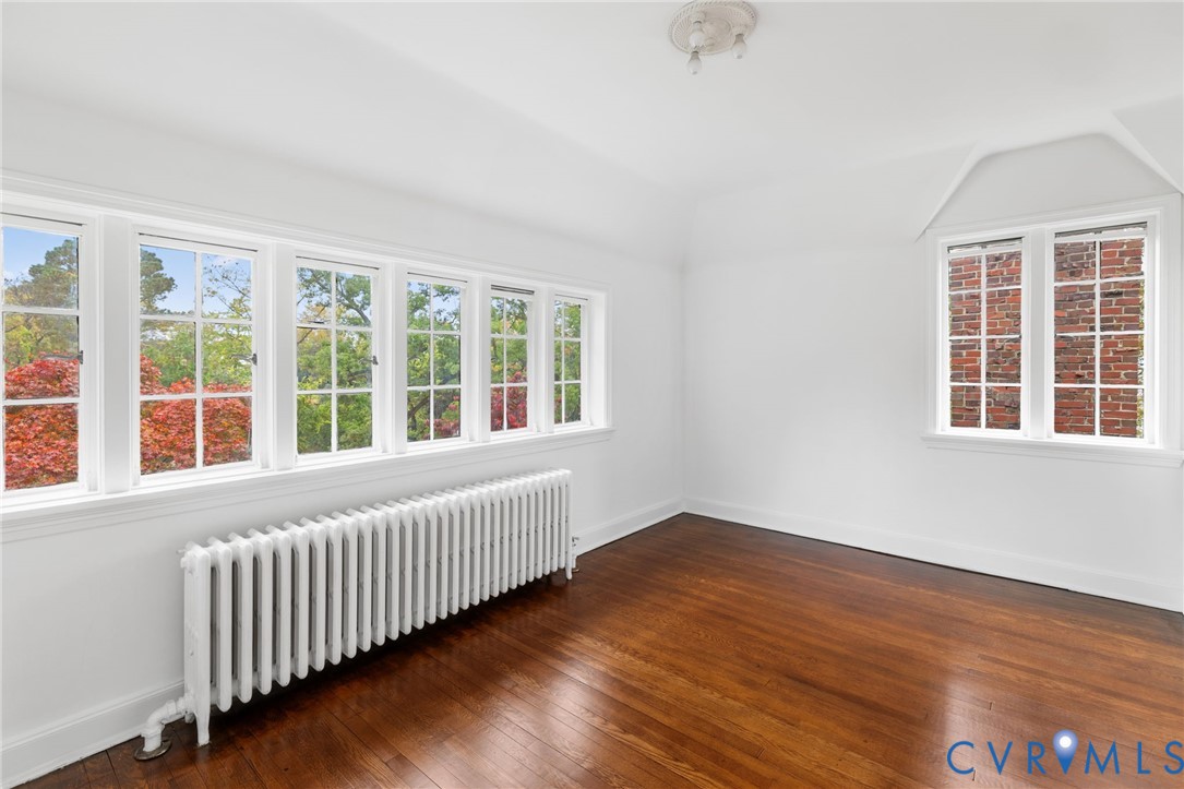 701 Appomattox Street Hopewell, VA 23860 - Photo 23 of 32 a view of an empty room with wooden floor and windows