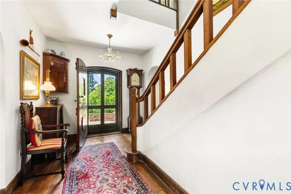 a living room with furniture and a rug