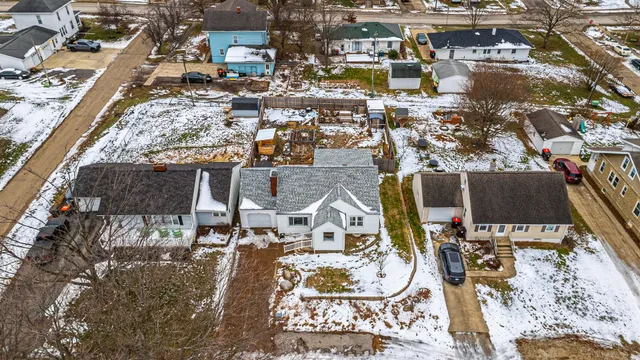 an aerial view of residential houses with outdoor space