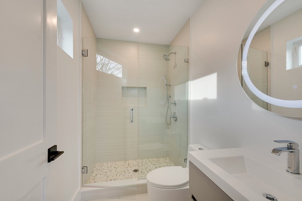 9 Richard Road Needham, MA 02492 - Photo 14 of 31 a bathroom with a bathtub a toilet and a shower