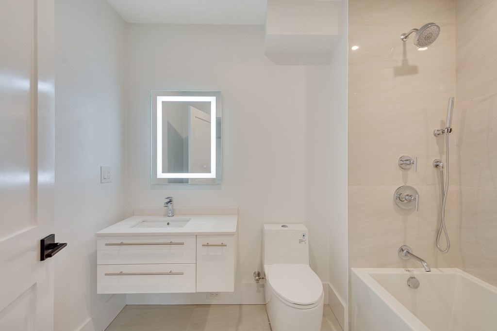 9 Richard Road Needham, MA 02492 - Photo 15 of 31 a bathroom with a sink a toilet and shower