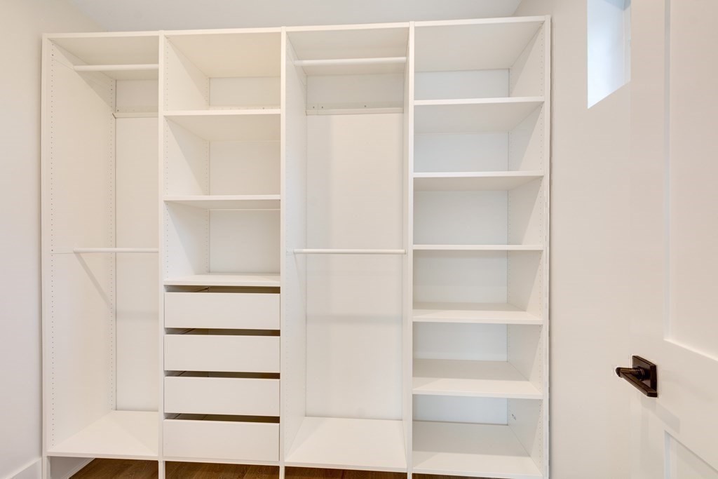 9 Richard Road Needham, MA 02492 - Photo 16 of 31 a view of walk in closet with empty racks