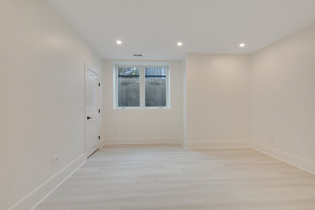 9 Richard Road Needham, MA 02492 - Photo 21 of 31 an empty room with a empty space and windows