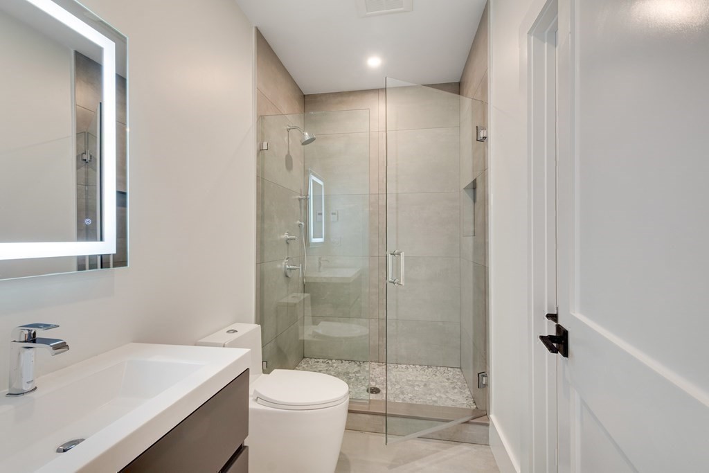 9 Richard Road Needham, MA 02492 - Photo 22 of 31 a bathroom with a sink toilet and shower