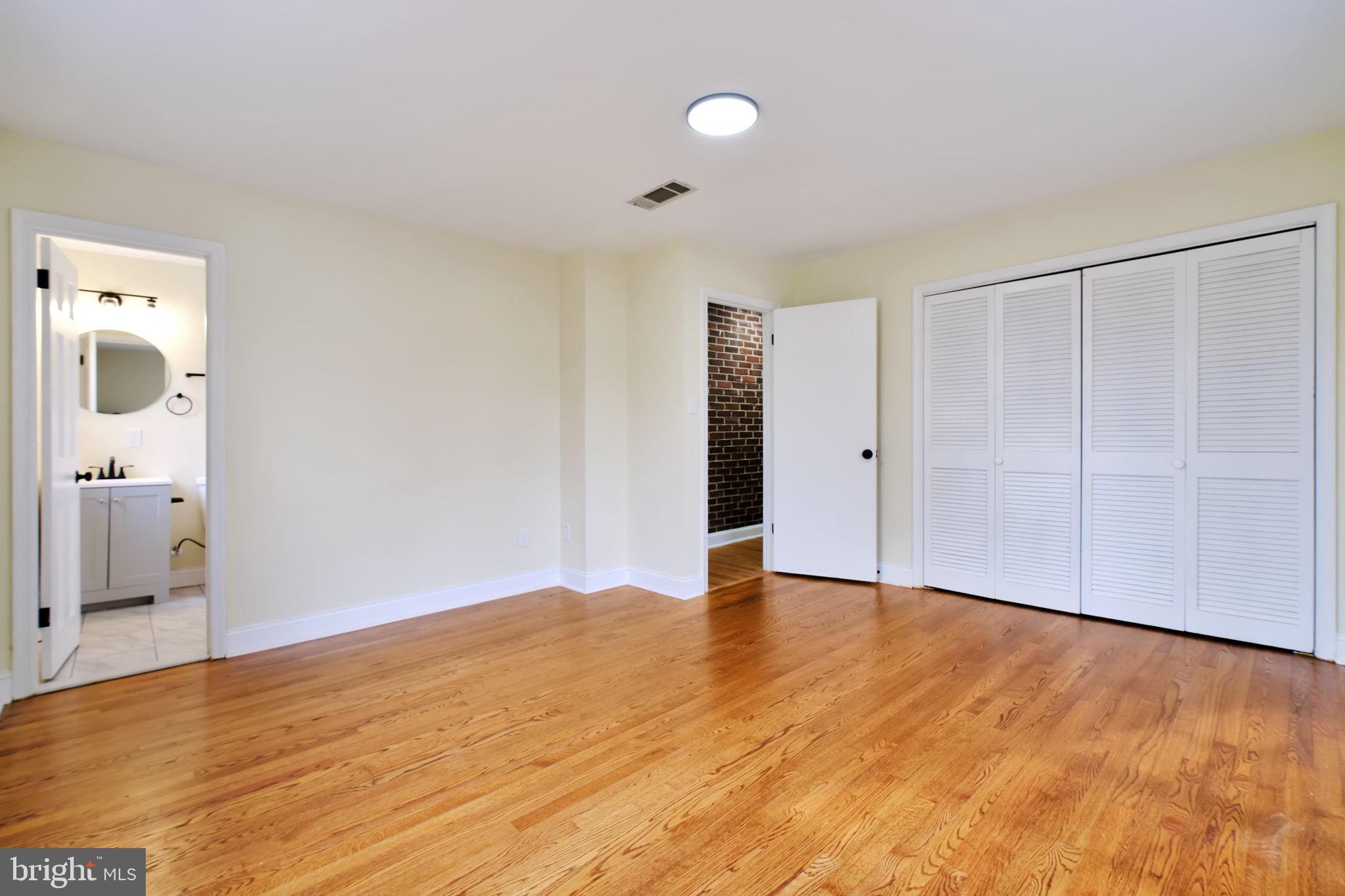 3509 Annandale Road Annandale, VA 22003 - Photo 13 of 30 a view of an empty room with wooden floor and a window