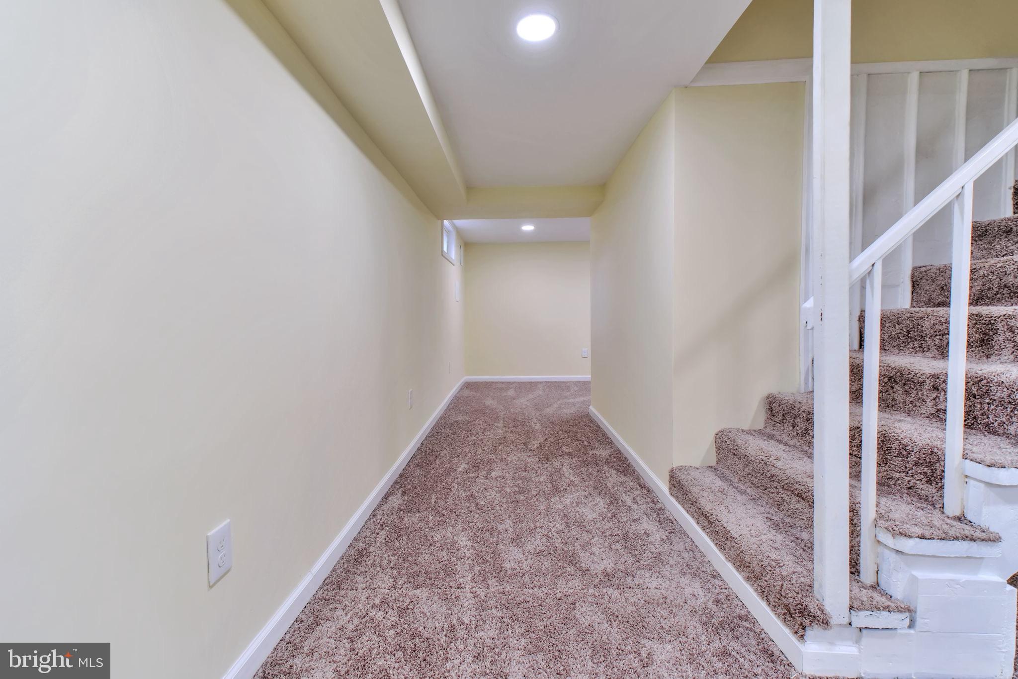3509 Annandale Road Annandale, VA 22003 - Photo 22 of 30 a view of a hallway with wooden floor and staircase