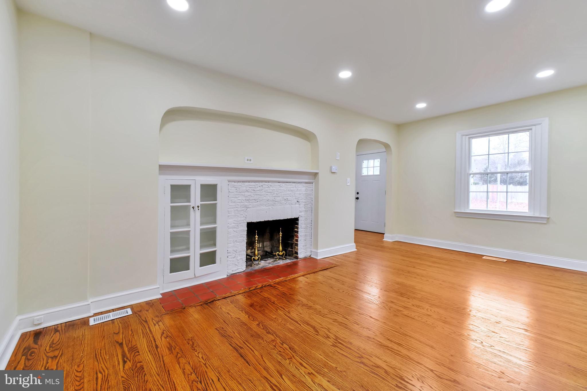 3509 Annandale Road Annandale, VA 22003 - Photo 3 of 30 a view of empty room with wooden floor and fireplace