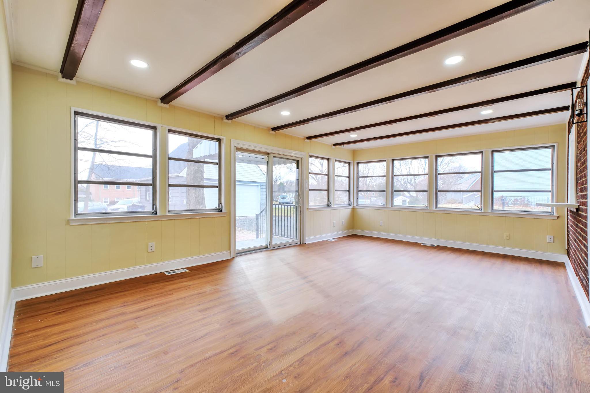 3509 Annandale Road Annandale, VA 22003 - Photo 7 of 30 a view of an empty room with a window and wooden floor