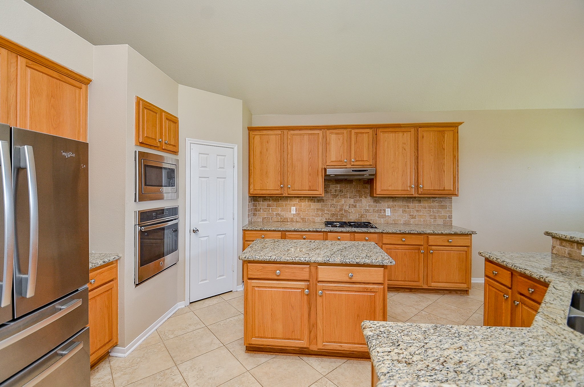 1222 Ragsdale Lane Katy, TX 77494 - Photo 14 of 31 Island is a perfect prep space. Backsplash highlights the granite. Plenty of cabinet space.