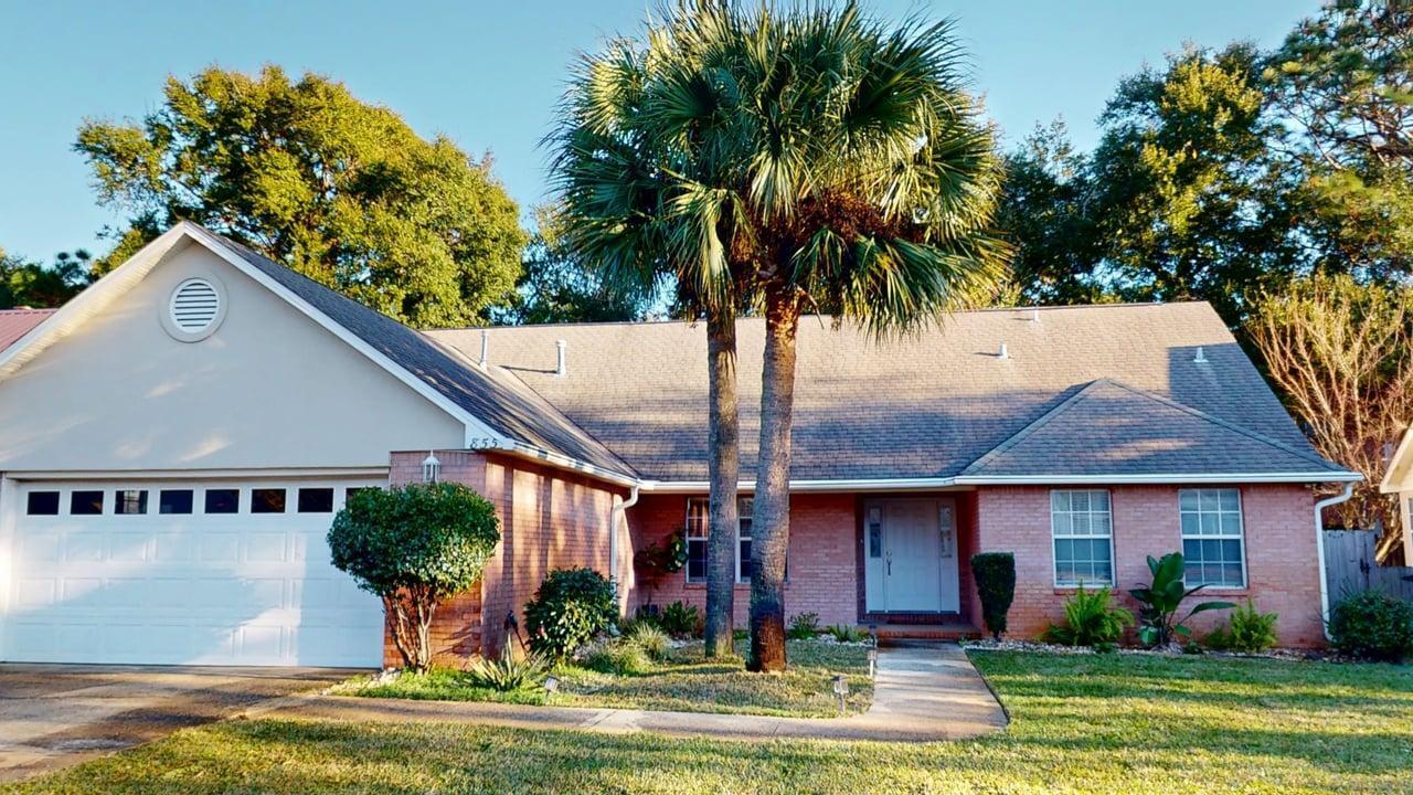 855 Mande Court Shalimar, FL 32579 - Photo 1 of 65 a front view of a house with garden