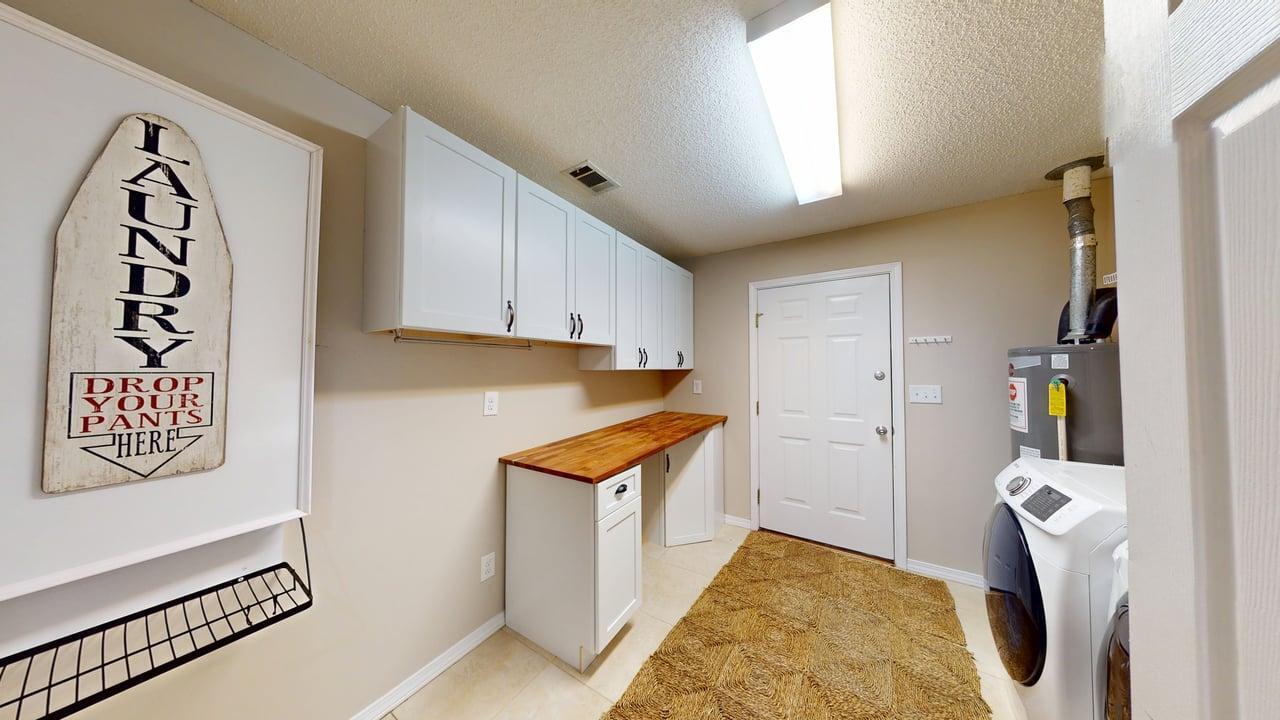 855 Mande Court Shalimar, FL 32579 - Photo 33 of 65 a view of walk in closet with clothes and shoes